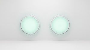 Modern surgical light domes in an accredited outpatient operating room — surgery center vs hospital comparison
